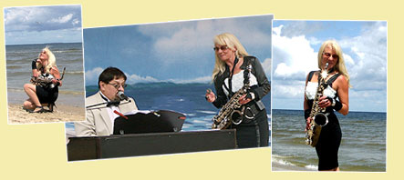 Saxophonistin mit Pianist beim KOnzert am Meer